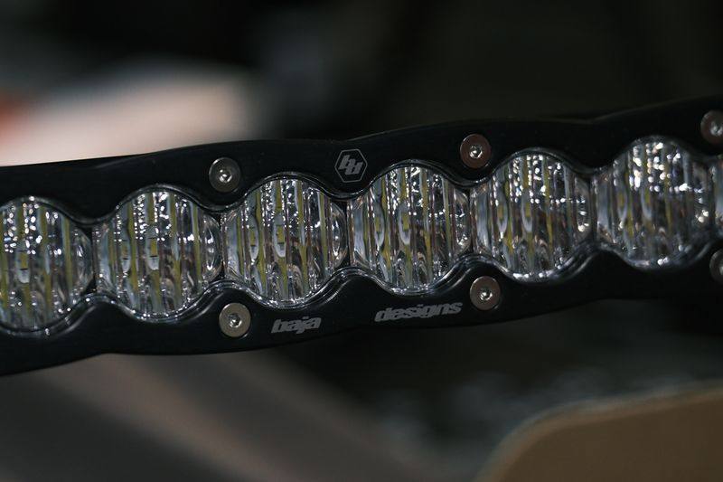 Close view of an LED light bar showing its lens elements.
