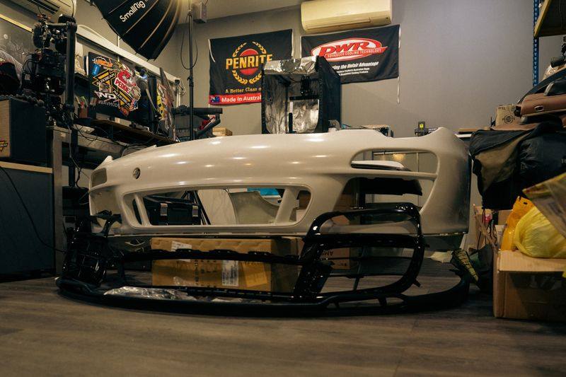 The same front bumper seen from an angle, showing its intake apertures.