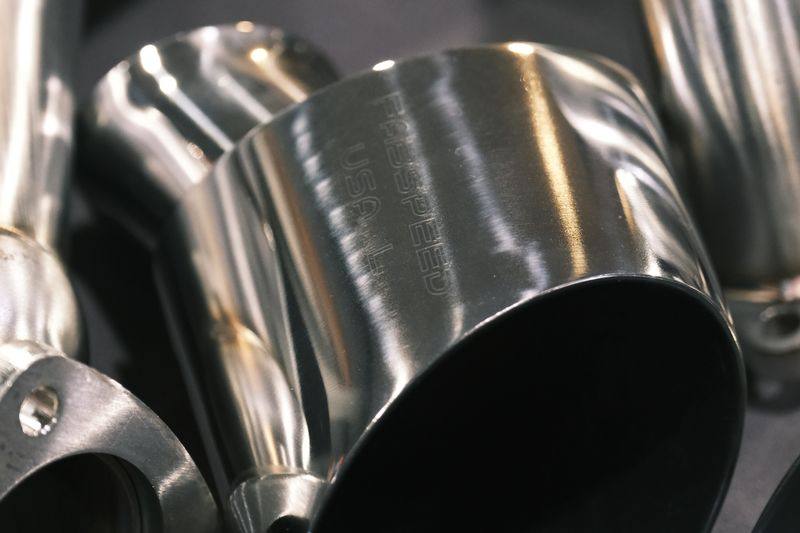 Close view into the open end of a large-diameter tailpipe.